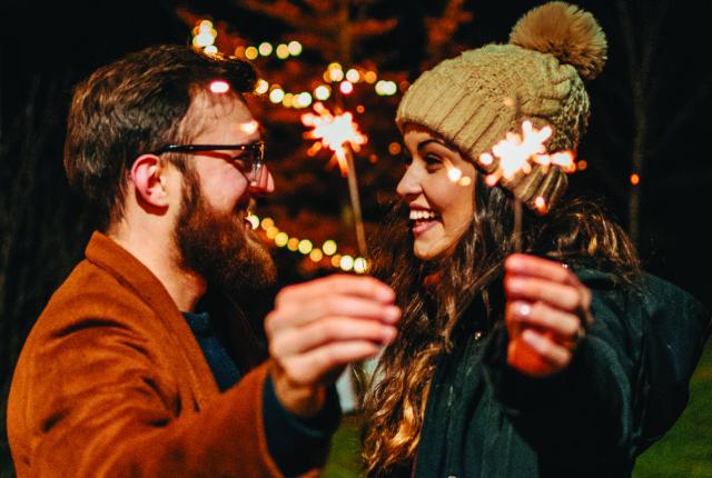 couple holding sparklers